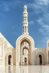 White marble arches and minaret, the Sultan Qaboos Grand Mosque