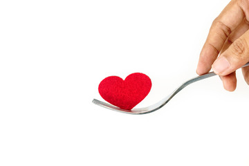 the red heart shape in silver fork , romance love dinning or health heart care concept