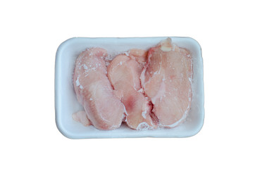 Frozen chicken fillets in white tray on white background, isolated