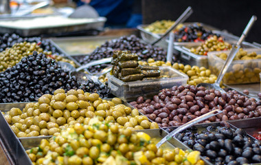 Varied pickled olives, on the market store counter