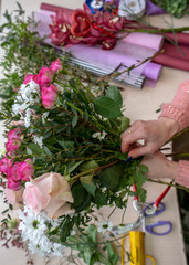 The process of making a festive bouquet girl florist.