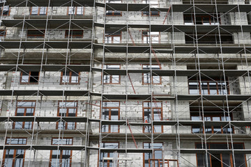 new building under construction, scaffolding and concrete