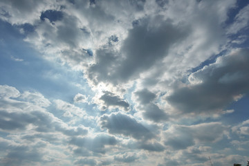 Beautiful sky full of clouds and the evening sun light.