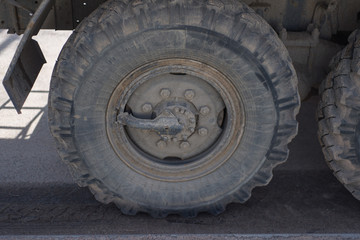 Fototapeta na wymiar big gray wheel on a lorry