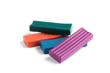 Colored plasticine isolated on white background. 