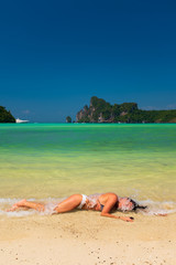 Fototapeta na wymiar Woman enjoying her holidays on the beach