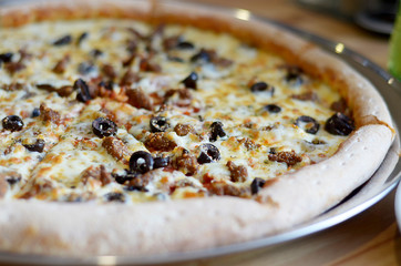 large fresh pizza with different filling