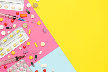 Bright background with copy space in the middle formed with different medication and pillows