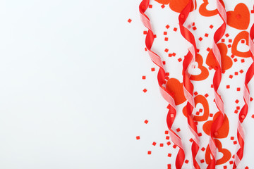 Background wit red ribbon and bright hearts for Valentine day decoration
