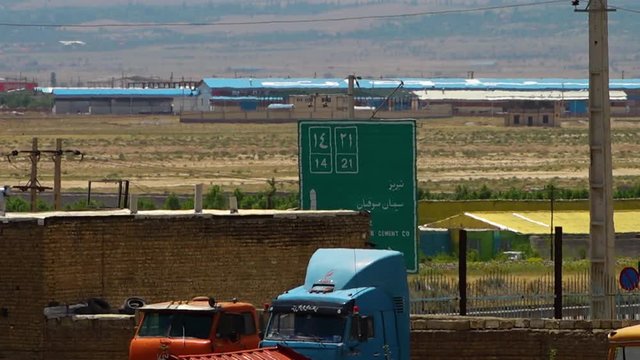 Iranian road sign giving directions to Road 14 and 21 in Azerbaijan.