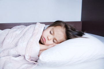 little girls sleeping lying on bed. sleep schedule in domestic lifestyle. cute baby child