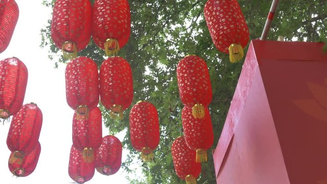 View below red hanging Chinese laterns