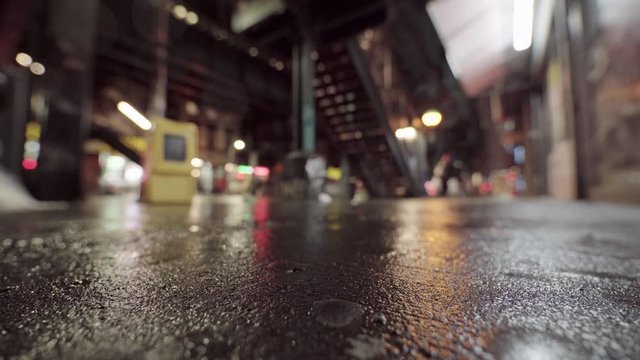 Out Of Focus Rainy Urban Street With Passerby, Night