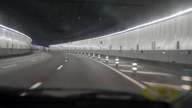 Driving on M30 empty tunnel in Madrid, Spain