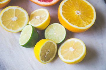 Naklejka na ściany i meble citrus fruits (grapefruit, orange, lemon, lime), on the wooden background.
