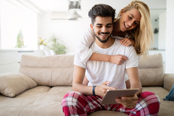 Young attractive couple spending time together at home
