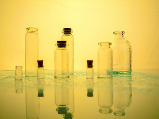 Few transparent bottles, water sprays. empty glass bottles.