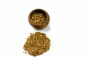 Buckwheat isolated on white background in a wooden plate isolated