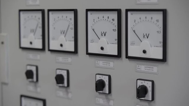 Monitor control in electricity power station. Close up control panel.