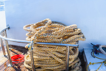 Thick ropes and different tackles on a yacht