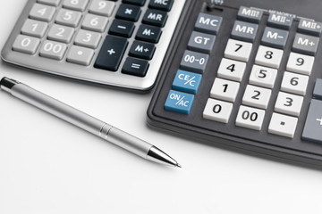 Business still life with calculator on table in office.