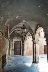 Ancient arcade in the center of Lucca, Tuscany, Italy