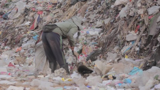 Illegal migrant worker in rubbish dump site in Mae Sot, Thailand.
