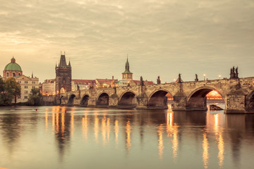 Fototapeta na wymiar Vintage Prague Landmarks - towers and bridge at light night
