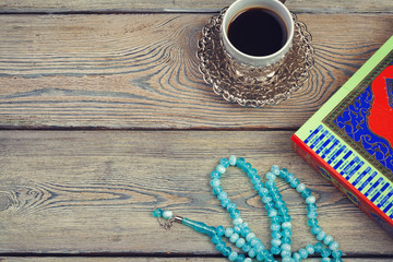 Three months. Islamic Holy Book Quran with rosary beads. Ramadan concept