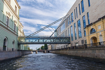 facades of the buildings of the Mariinsky Theater in St. Petersburg with a suspension bridge over the canal