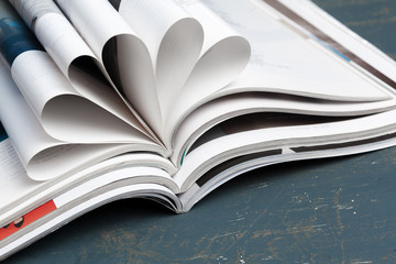 Close up stacking magazine place on table background