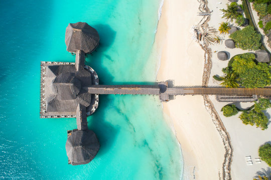 aerial view to beach and wooden restaurant in Tanzania