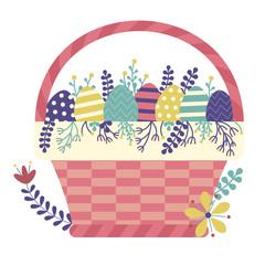Wicker Easter basket filled with colored ornamented eggs, flowers, leafs, twigs, berries and other egg hunt symbols. Spring festive traditional straw basket icon.
