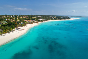 Fototapeta na wymiar sand coast and blue sea on Zanzibar