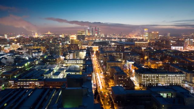 Amazing motion timelapse of Moscow city center on the night, view from above. Aerial shot of busy highways with a lot of traffic and glittering buildings lights. 8K ultra high definition footage.