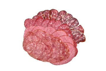 Plate with sliced sausage slices of different varieties, background and texture, isolate