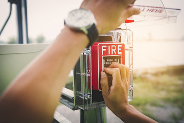 safety officer working on checking Fire extinguisher at outdoor plant