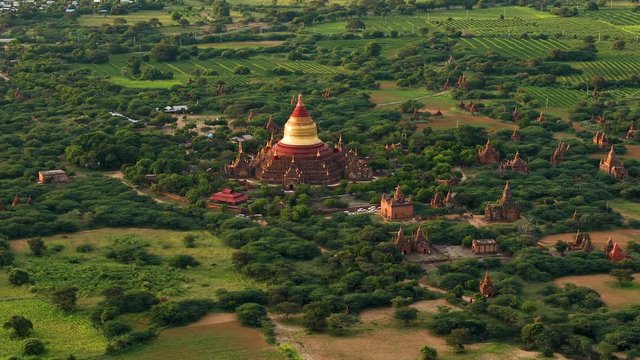 Flying over an amazing landscape of hundreds of Buddhist monuments and temples in Bagan, Myanmar.