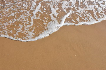 Fototapeta na wymiar High angle view of the waves on the beach