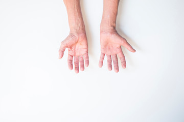 Both palms and fingers of the elderly man on a white background