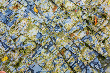Closeup - beautiful structure of an ancient rock texture formation. Concept of natural background...