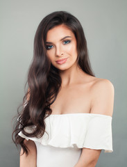 Fototapeta premium Smiling woman with long perfect hairstyle portrait