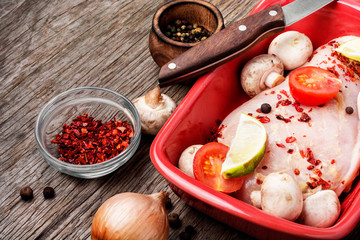 Raw uncooked chicken breasts