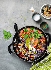 Legumes and tomatoes in a pot