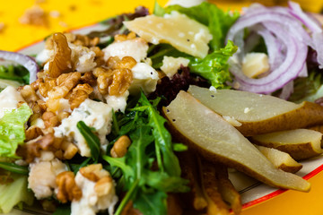 vege salad with pear, walnut, cheese and green leaf.