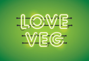 Love veg neon florescent lighting message on a green background
