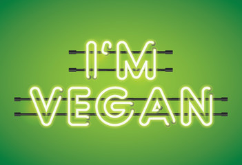 I'm Vegan neon florescent lighting message on a green background