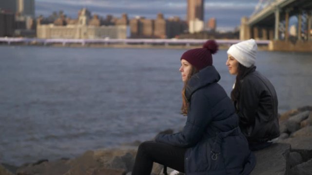 Two friends in New York enjoy the amazing view over the skyline of Manhattan