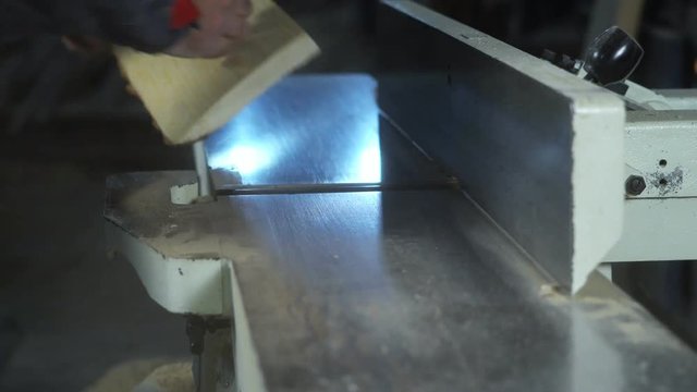 the wood on the jointer machine