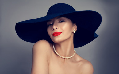 Beautiful sexy woman with red lips makeup and blue hat, fashion portrait